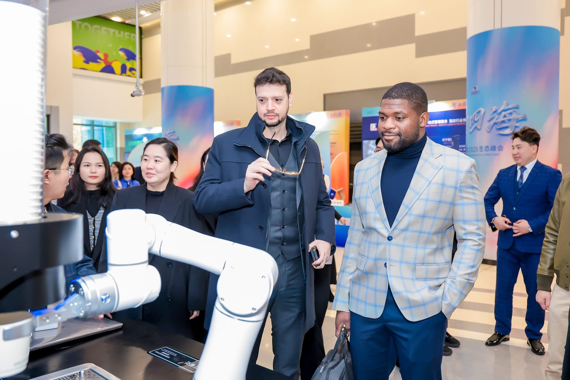Jay Dastin and Patrick Che at a hotel robotics demonstration